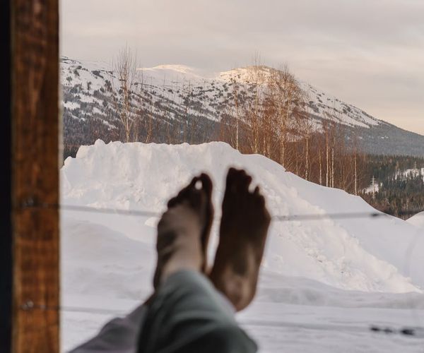 Smiling person stretching outdoors feeling the benefits of practice.